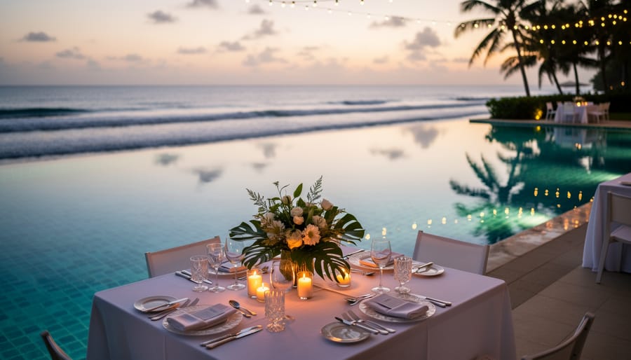 Infinity poolside reception with white linens and tropical florals at Sugar Beach.